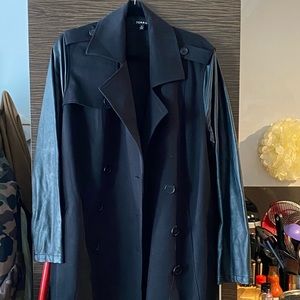 Black trench coat with leather-look sleeves